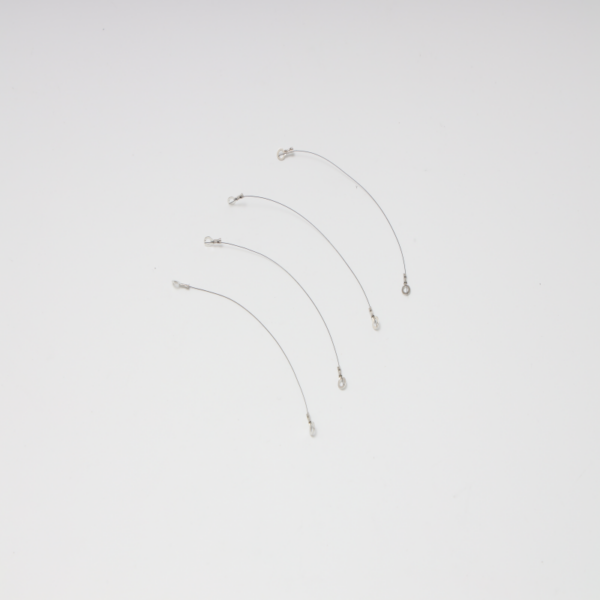 Close-up of superelastic nitinol memory wire for sale used in a compact actuator system.